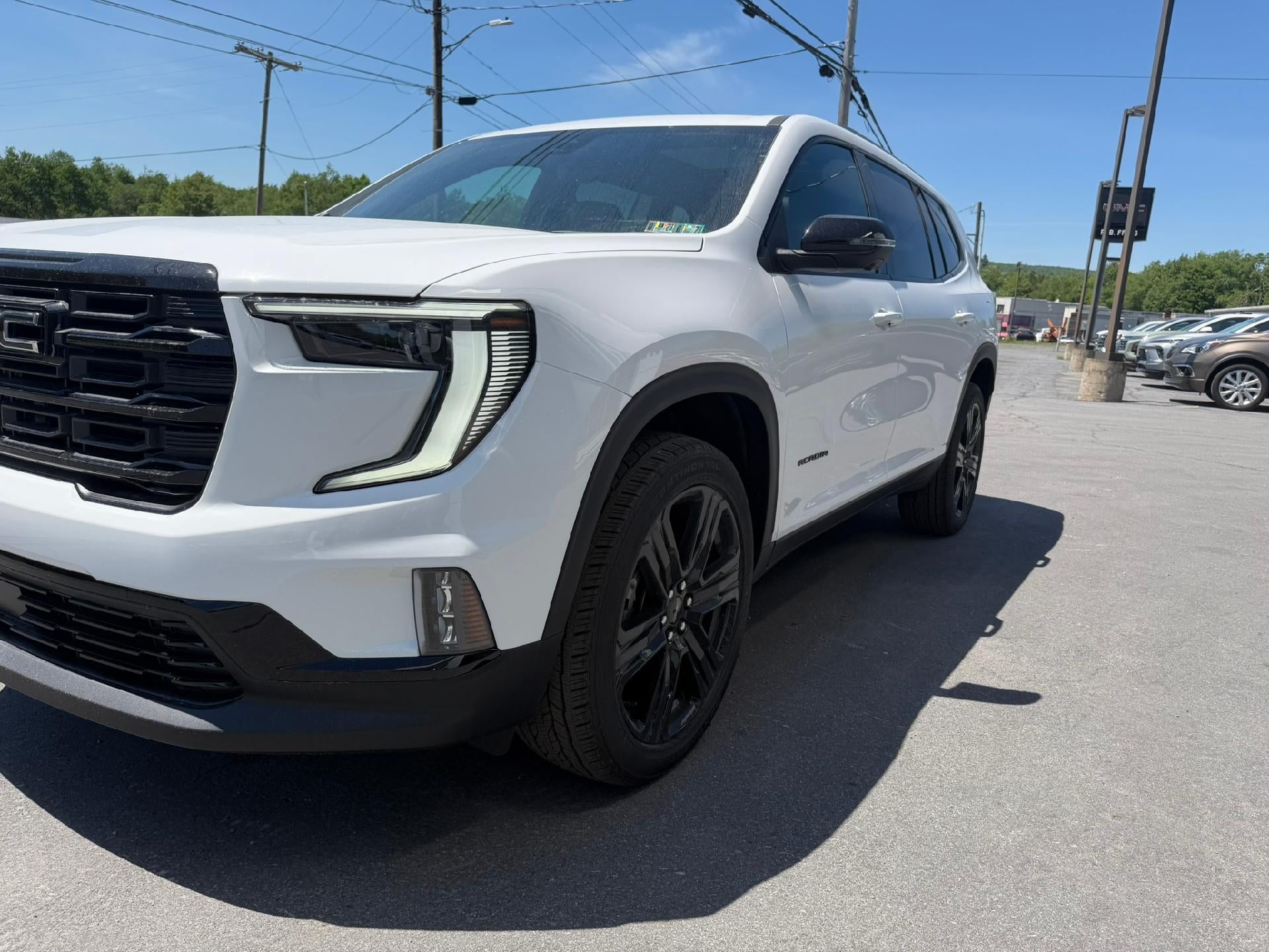 2026 GMC Acadia Elevation in Summit White — front three-quarter view
