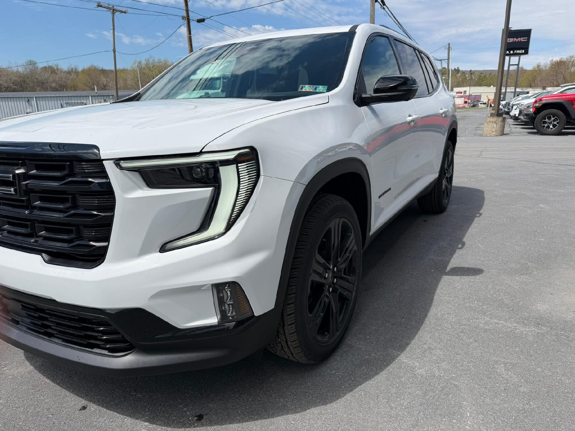 2026 GMC Acadia Elevation in Summit White — front three-quarter view