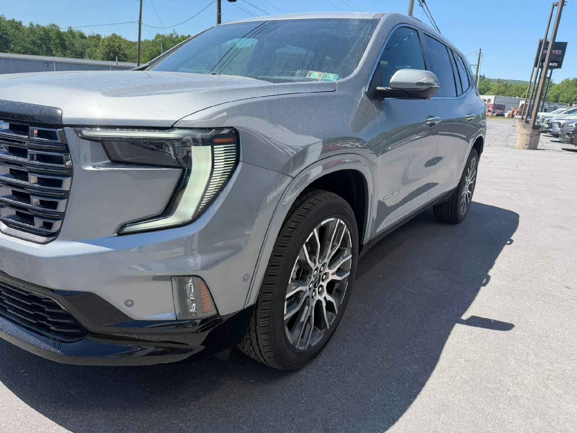 2026 GMC Acadia Denali Ultimate in Sterling Metallic — front three-quarter view
