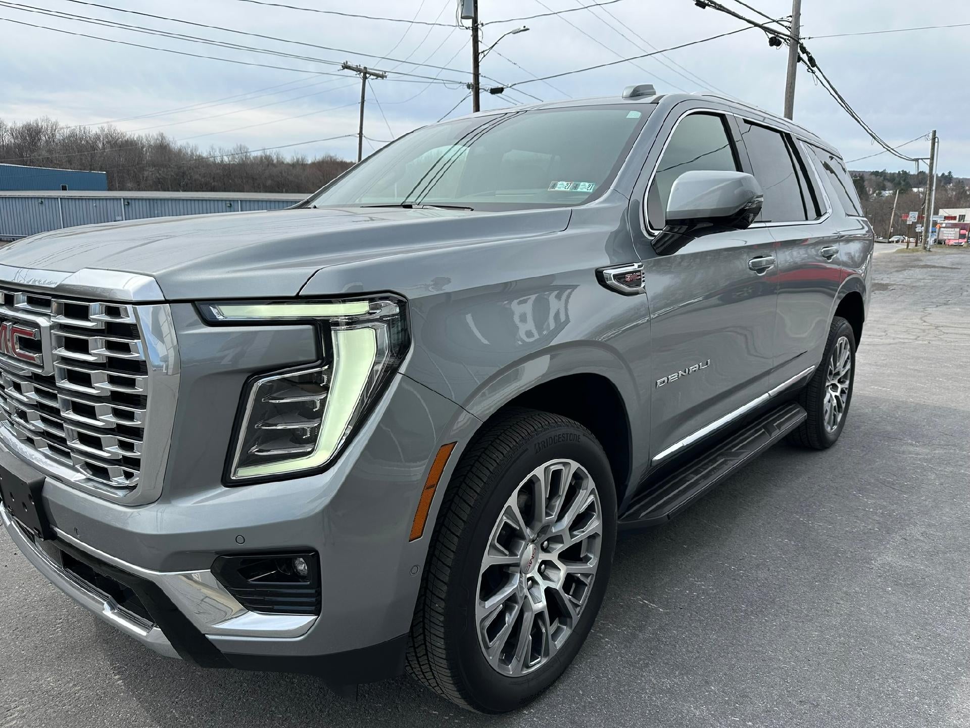 2025 GMC Yukon Denali in Sterling Metallic — front three-quarter view