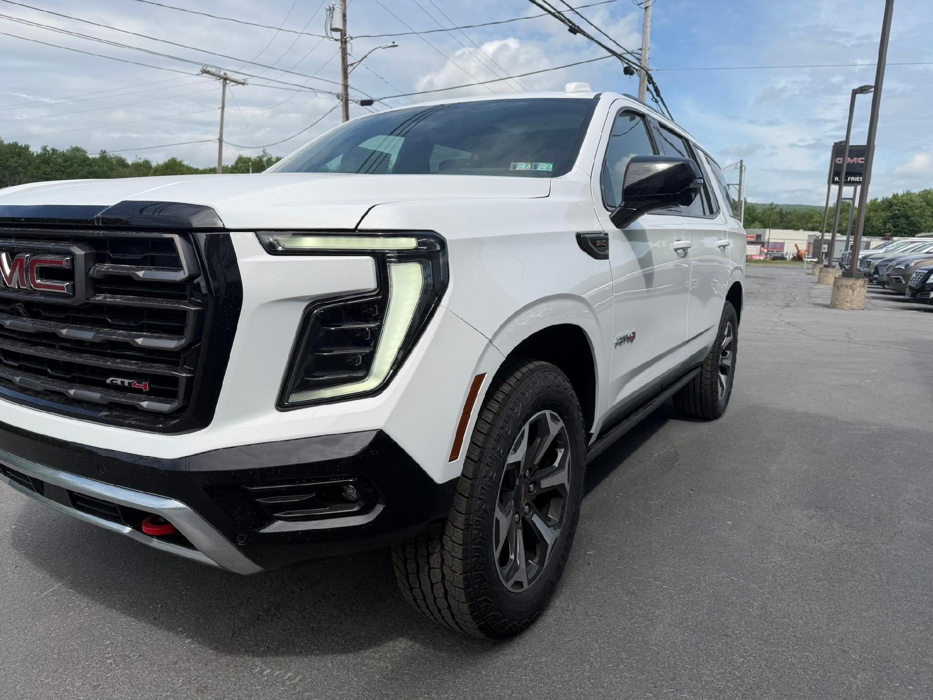 2026 GMC Yukon AT4 Ultimate in Summit White — front three-quarter view
