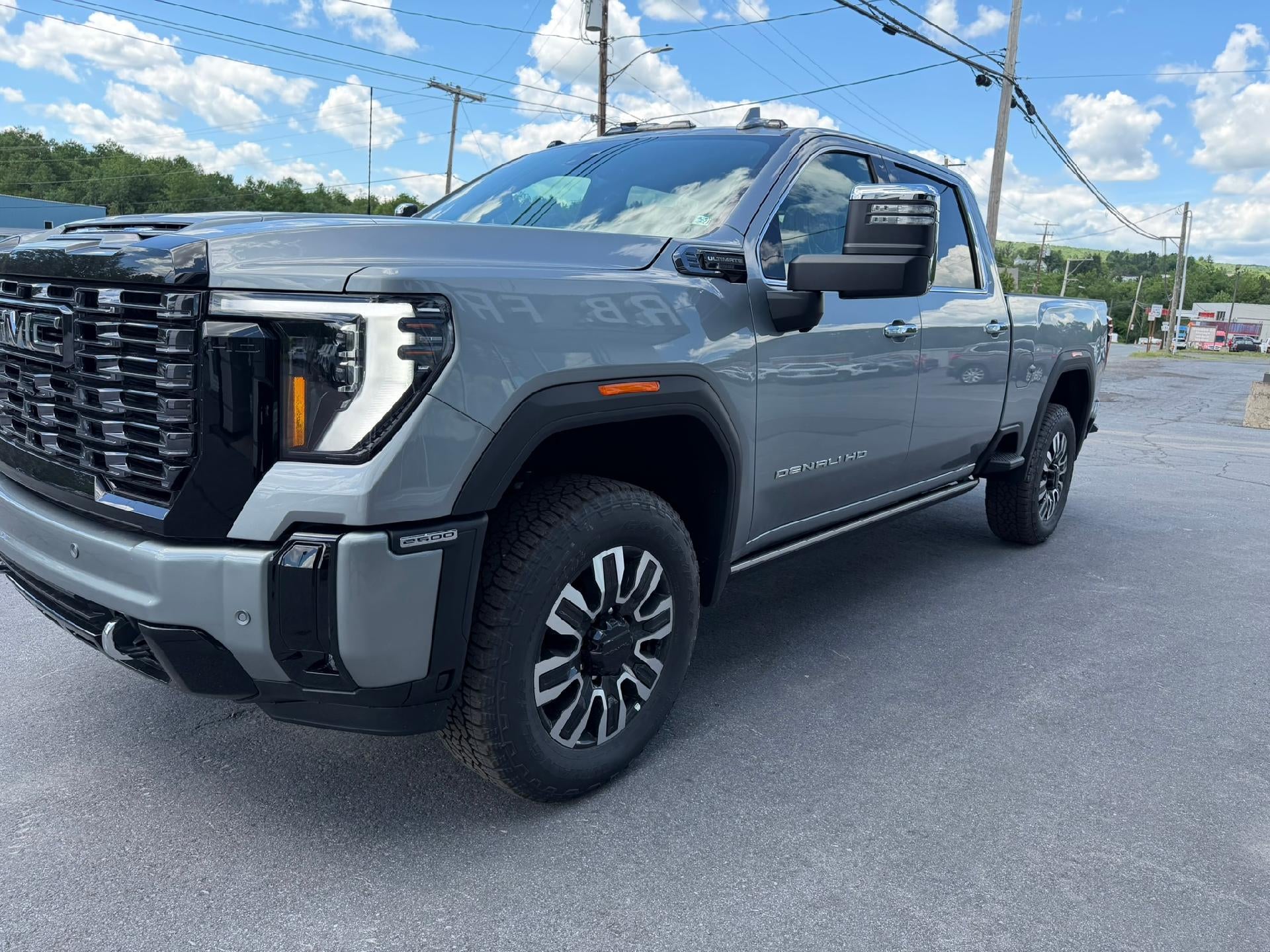 2026 GMC Sierra 2500 HD Denali Ultimate in Sterling Metallic — front three-quarter view