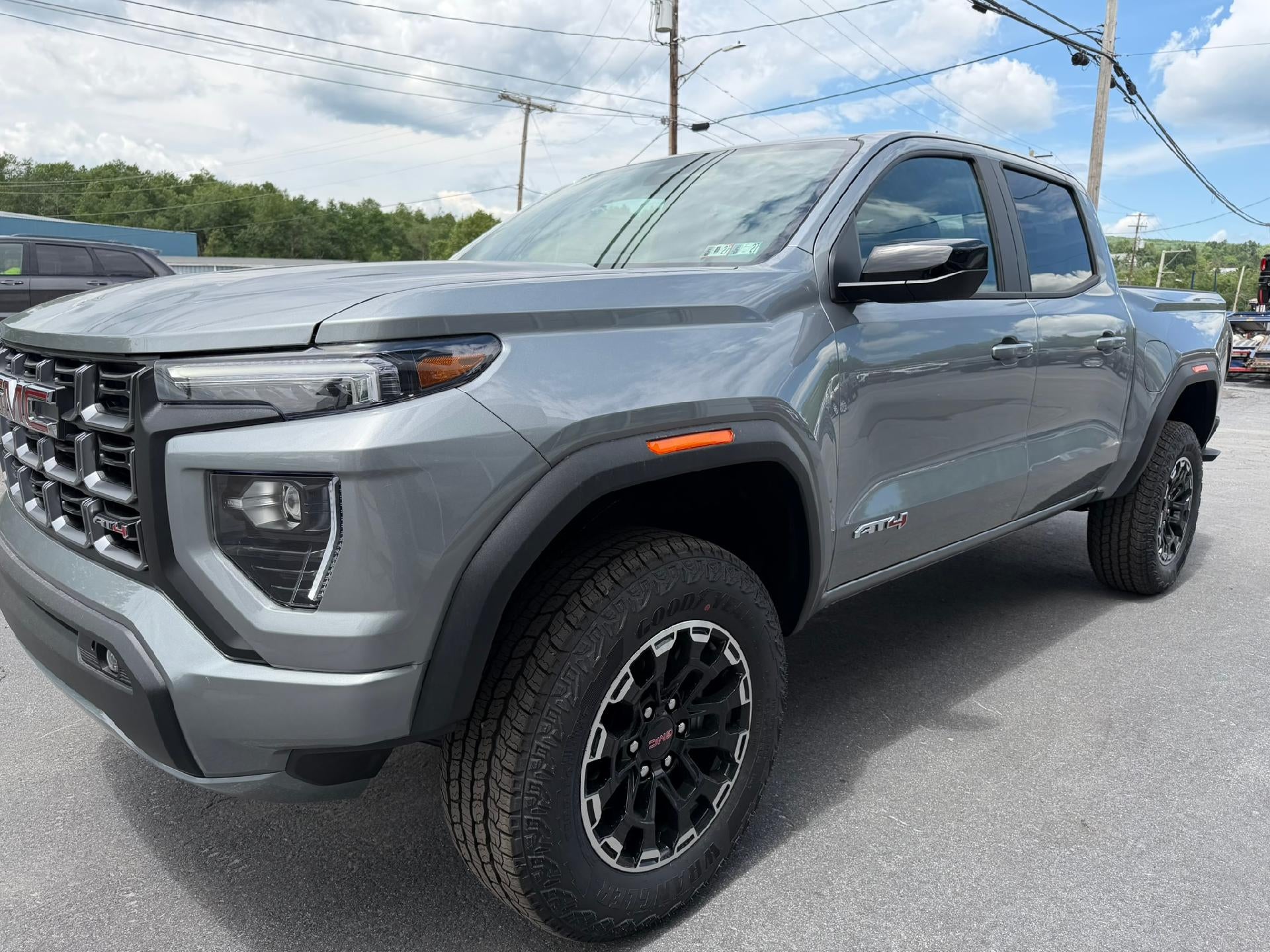 2026 GMC Canyon AT4 in Sterling Metallic — front three-quarter view